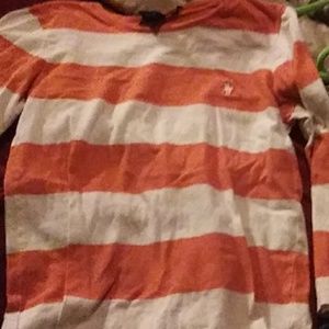 A stripe oragnge and white long sleeve shirt